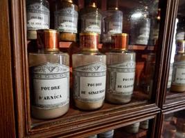 Vintage vials with ointments, infusions and powders, homeopathy. Medieval pharmacy. photo