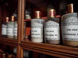 Vintage vials with ointments, infusions and powders, homeopathy. Medieval pharmacy. photo