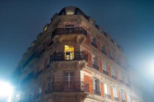 Chic rich building in Strasbourg, perspective view. Fog, night. photo