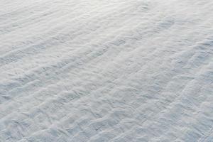 Snow-covered white fields in Alsace, top view. White desert. photo
