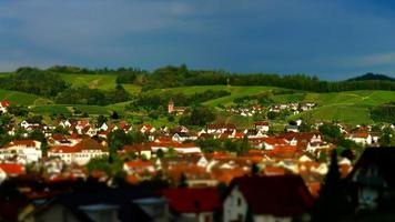 Little cozy german village between the green hills, vineyards in Black Forest photo