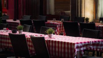 Lonely tables of street cafe at night, Strasbourg photo