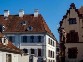 Calm narrow street, sunny summer day, cozy old downtown, Basel photo