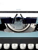 Vintage typewriter, writer or author's tool, inspiration and creativity. On a black background. photo