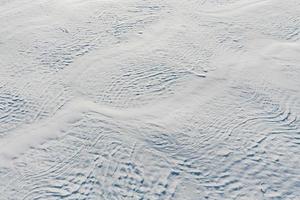 Snow-covered white fields in Alsace, top view. White desert. photo