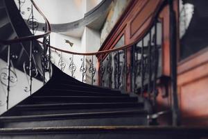 Antique vintage rounded staircase in old house, Strasbourg, France photo