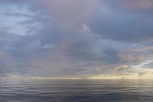 Seascape with evening overcast sky over the sea photo