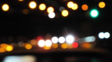 City lights blurred abstract background. night time city with colorful light. photo