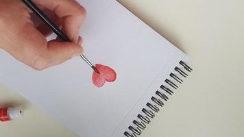 libreta con corazones de acuarela en espiral libreta para obras de arte. foto