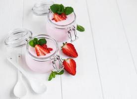 Jars with strawberry yogurt photo