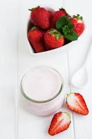 Jar with strawberry yogurt photo