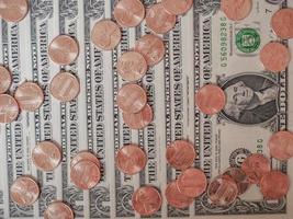 Dollar coins and notes photo