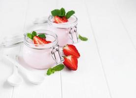 Jars with strawberry yogurt photo