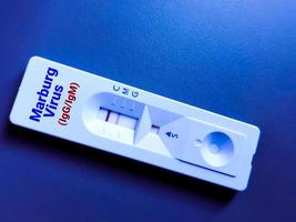 Marburg virus IgM positive result by using rapid test cassette photo