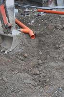 Plastic pipe in construction site photo