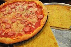 pepperoni pizza and farinata baked food photo