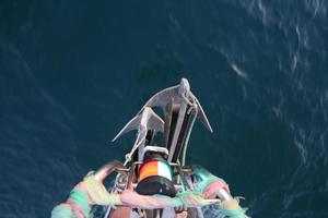 Gulf of Thailand, Prachuap Khiri Khan, Thailand 2022 -Anchor and navigation lights view on a sailboat photo