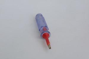 small screwdriver with transparent handle photo