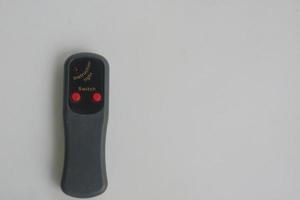 small gray remote on a white background photo