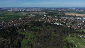 Aerial view of a park with castle and lake in 4K video