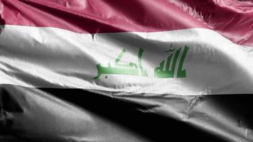 Iraq textile flag slow waving on the wind loop. Iraqi banner smoothly swaying on the breeze. Fabric textile tissue. Full filling background. 20 seconds loop. video