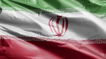 Irans flagga vajar långsamt på vindslingan. iran banderoll smidigt vajande på vinden. full fyllning bakgrund. 20 sekunders loop. video