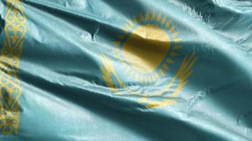 Kazakhstan textile flag slow waving on the wind loop. Kazakh banner smoothly swaying on the breeze. Fabric textile tissue. Full filling background. 20 seconds loop. video