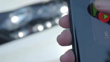 Unlock and lock Car Using Smartphone App. Man hand Unlocking car video