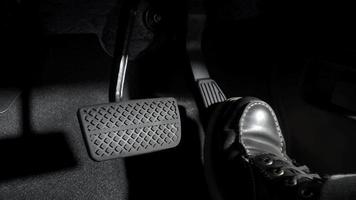 Accelerate and Brake. Foot pressing foot pedal of a car to drive ahead. video