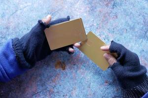 hacker hand stealing data from credit card photo