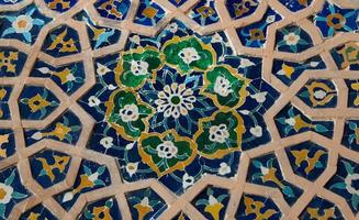 asian old ceramic mosaic. elements of oriental ornament on ceramic tiles photo