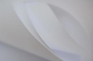 abstract background of a twisted sheet of white paper photo