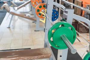 sports equipment and barbells in the gym photo