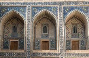 Arch and architecture of the ancient Registan in Samarkand. Ancient architecture of Central Asia photo