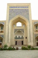 High arch and door with traditional Oriental mosaic. the ancient buildings of medieval Asia photo