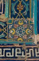 asian old ceramic mosaic. elements of oriental ornament on ceramic tiles photo