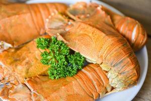 Flathead lobster shrimps served on white plate, fresh slipper lobster flathead boiled cooking with  parsley in the seafood restaurant, Rock Lobster Moreton Bay Bug photo