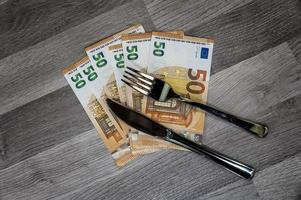 50 euro banknotes with fork and knife photo