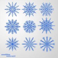 set 9 copos de nieve azules diferentes vector