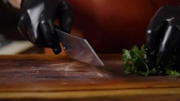 Fresh Green Parsley Chopping on a Wooden Chopping Board by Chef. video