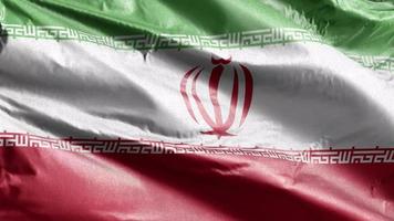 Iran textile flag slow waving on the wind loop. Iran banner smoothly swaying on the breeze. Fabric textile tissue. Full filling background. 20 seconds loop. video