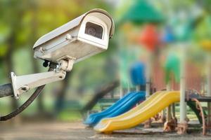 CCTV Closed circuit camera, TV monitoring at kindergarten school playground outdoor for kid children, security system concept. photo