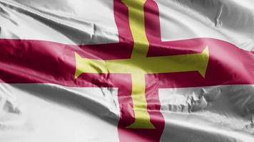 Guernsey flag waving on the wind loop. Gernian banner swaying on the breeze. Full filling background. 10 seconds loop. video