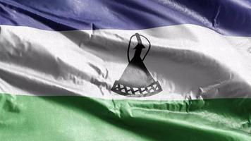 Lesotho textile flag waving on the wind loop. Lesotho banner swaying on the breeze. Fabric textile tissue. Full filling background. 10 seconds loop. video