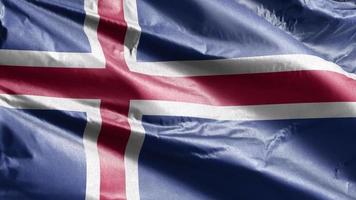 Bandera textil de islandia ondeando lentamente en el bucle de viento. bandera de islandia balanceándose suavemente con la brisa. tejido textil tejido. fondo de relleno completo. Bucle de 20 segundos. video