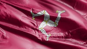 Isle of Man flag waving on the wind loop. Isle of Man banner swaying on the breeze. Full filling background. 10 seconds loop. video