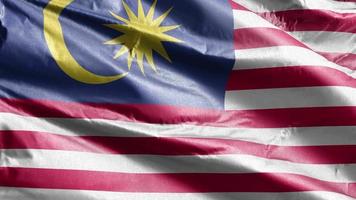 Malaysia textile flag slow waving on the wind loop. Malaysian banner smoothly swaying on the breeze. Fabric textile tissue. Full filling background. 20 seconds loop. video