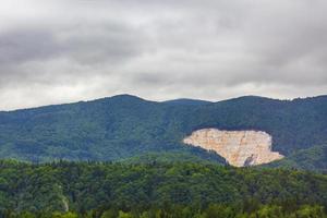 Hills forests landscape hole great pit in the mountain Slovenia. photo