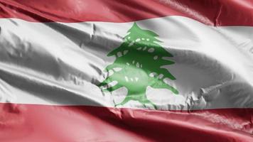 libanonfahne weht auf der windschleife. libanesische Fahne, die auf der Brise schwankt. voll ausfüllender Hintergrund. 10 Sekunden Schleife. video