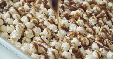 Pouring caramel melts down on mushroom popcorn, Slow Motion, 4K video